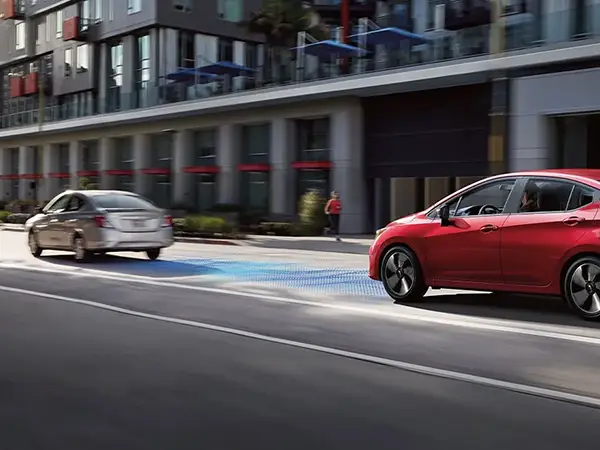 2025 Nissan Versa safely following a car